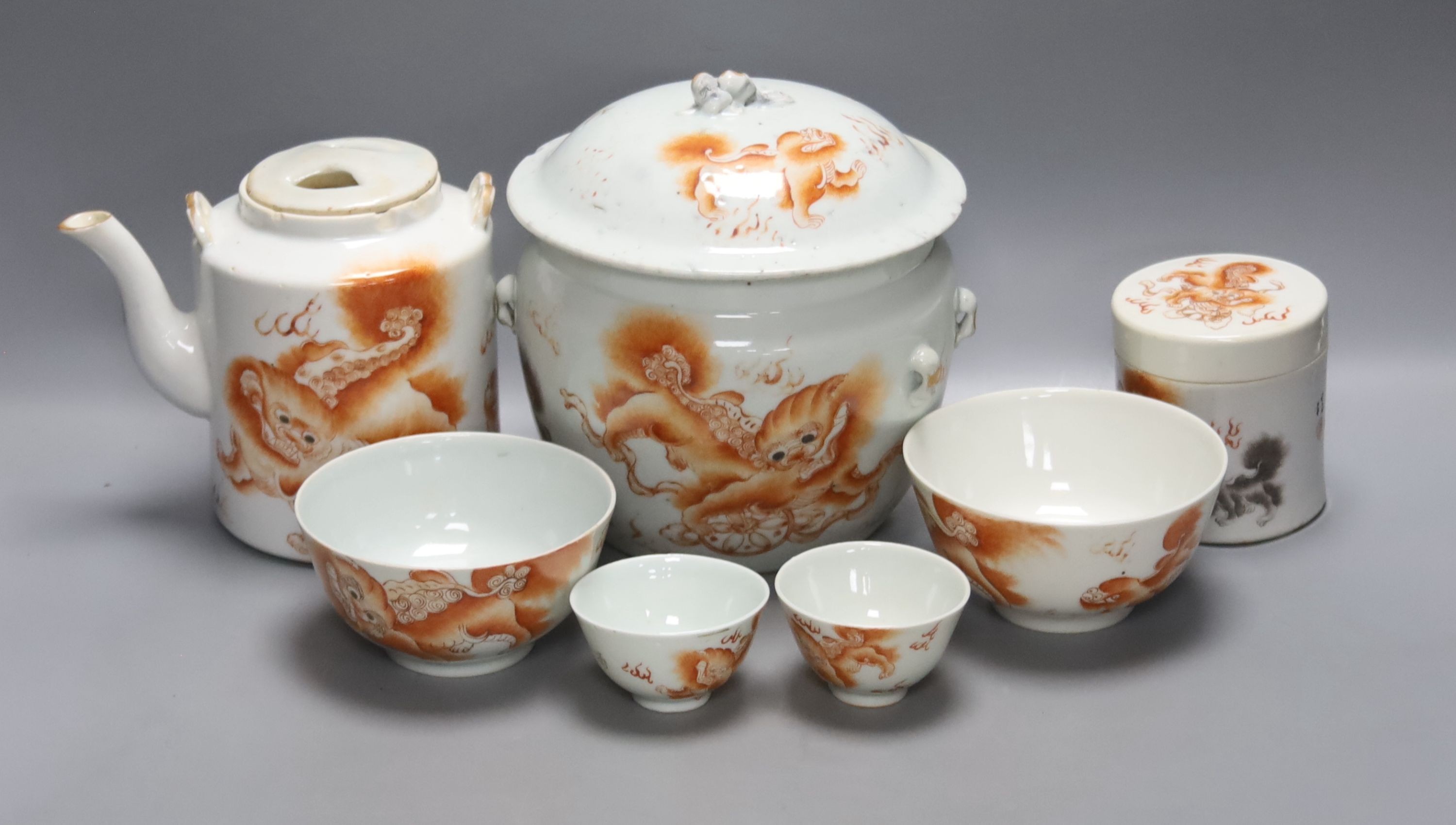A group of 19th century Chinese porcelain table ware, painted in iron red, teapot 14cm